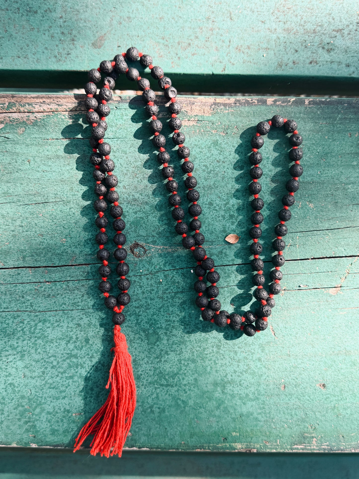 Lava Stone Mala Necklace with Red Tassel